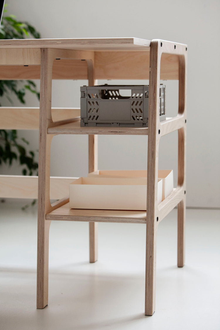 Detail-of-Mid-century-modern-corner-desk-with-drawers-and-shelves-in-natural-wood-stain