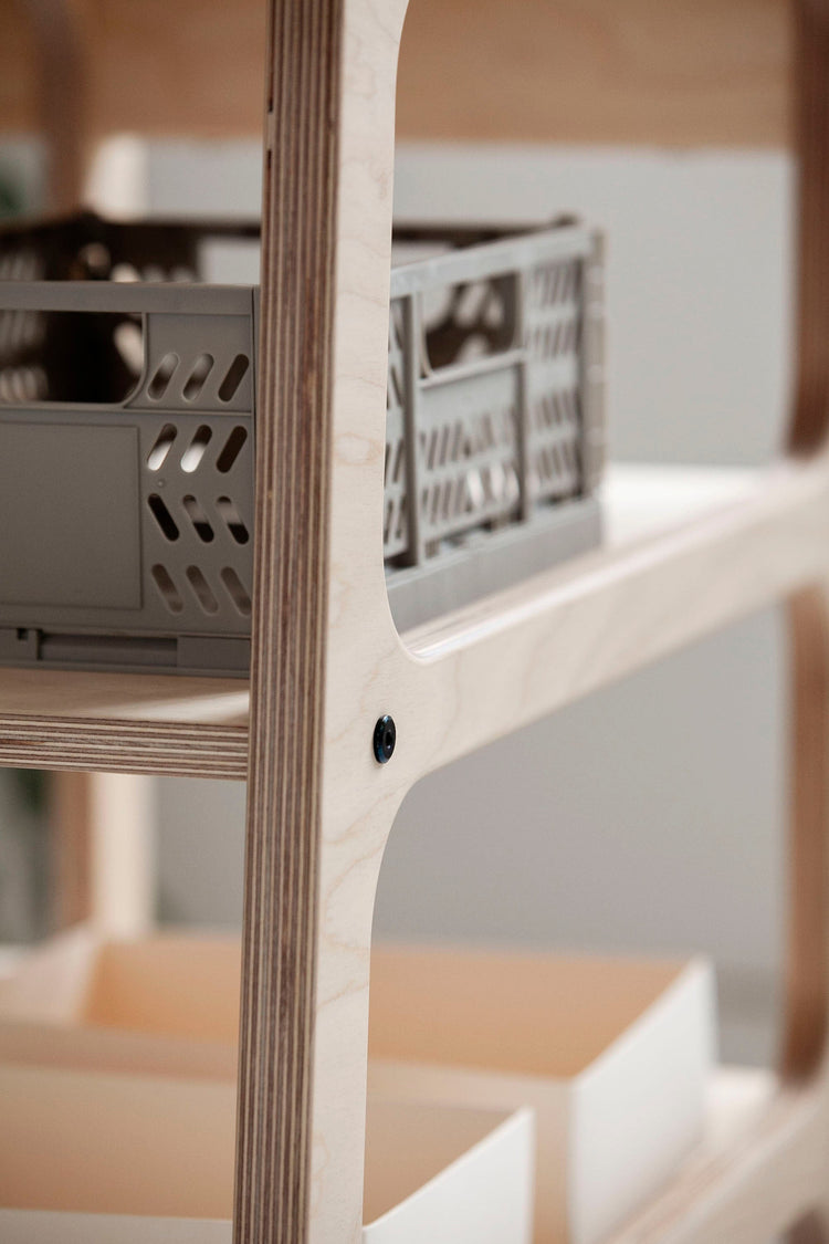 Detail-of-Mid-century-modern-l-shape-desk-with-drawers-and-shelves-in-natural-wood-stain